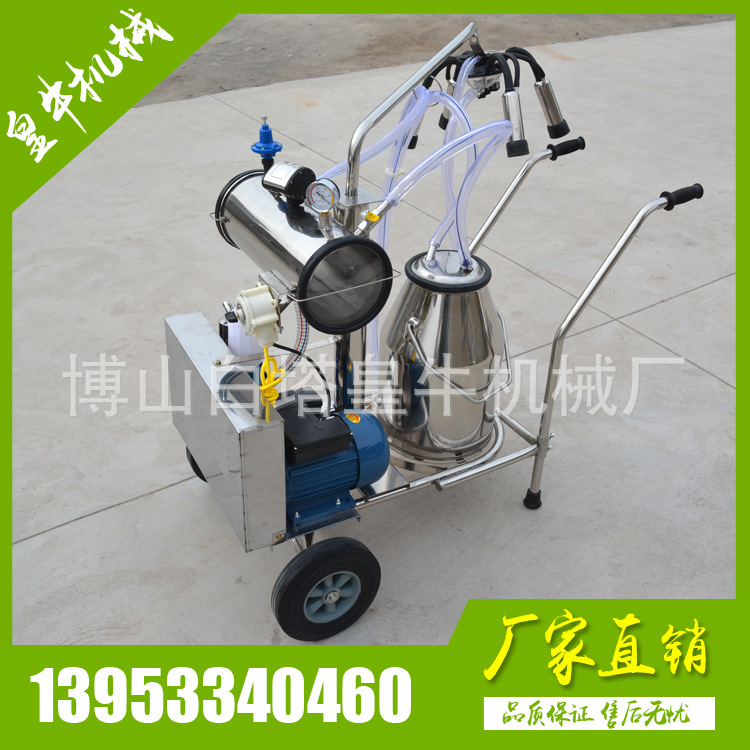 擠奶機